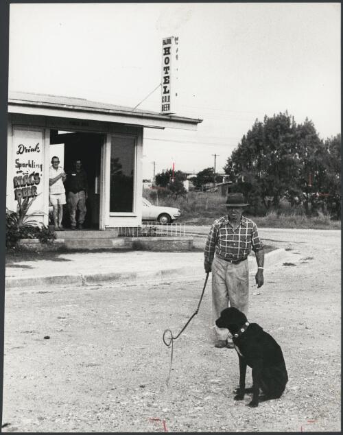 Ginty and his dog, Jack, outside the hotel at Bajool, Queensland, ca. 1972 [picture] / Bruce Howard