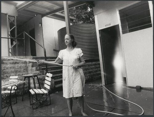 Hosing out the hotel bar, Thursday Island, Queensland, ca. 1972 [picture] / Bruce Howard