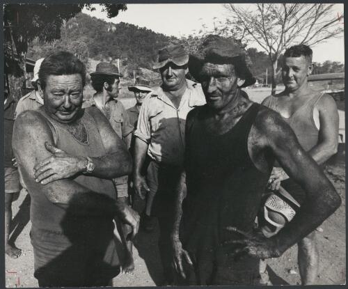 Right-oh, the fire's out, let's drink it; fire-fighters who saved the pub from a bushfire, Kuttabul, Queensland, ca. 1972 [picture] / Bruce Howard