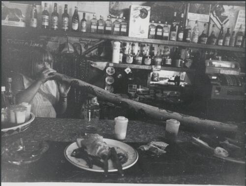 Pauline Fisher playing a didgeridoo at the pub, Barrow Creek, Northern Territory, November, 1972 [picture] / Bruce Howard