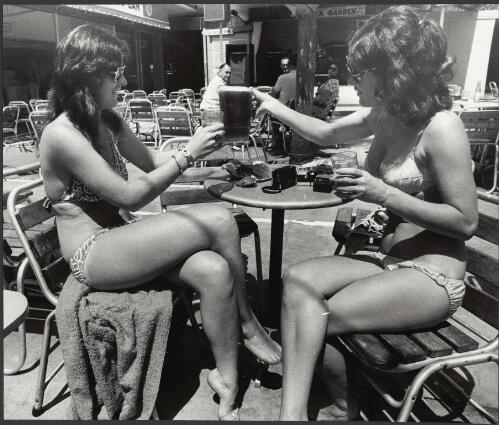 Girls with another jug outside the Surfer's Paradise Hotel, Surfer's Paradise, Queensland, ca. 1972 [picture] / Bruce Howard
