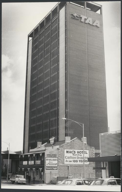 Mac's Hotel in front of the TAA building, Melbourne, Victoria, ca. 1972 [picture] / Bruce Howard