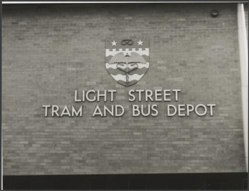 Crest on the front of the Light Street Tram and Bus Depot in Ann Street, Brisbane, ca. 1965 [picture]