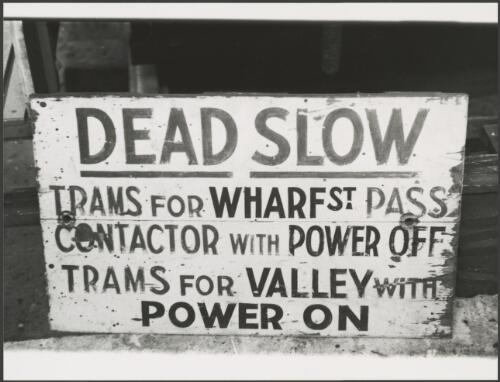 Sign from tram: Dead Slow trams for Wharf St pass contactor with power off, trams for Valley with power on, Brisbane Tramway Museum, Queensland, ca. 1976 [picture]