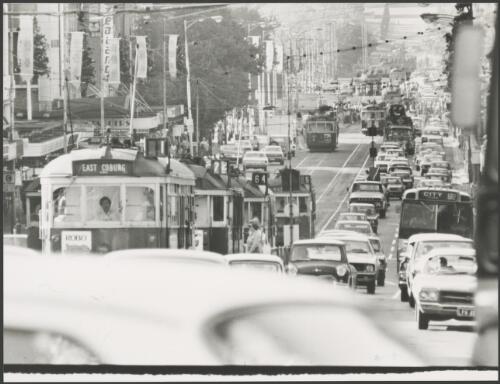 Swanston Street looking south from Bourke Street, showing trams and Christmas decorations, Melbourne, 1976 [picture]