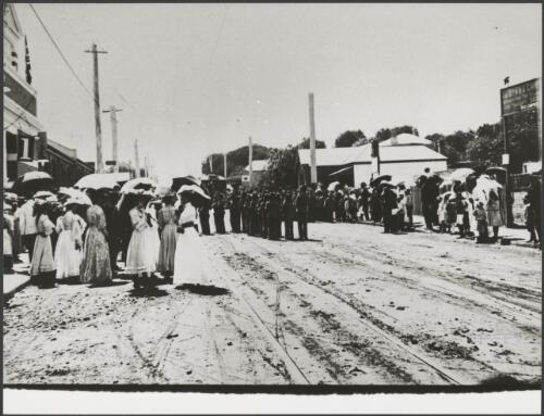 Military guard, spectators and a tram, possibly at the opening of a tramway, Perth or Fremantle, Western Australia, ca. 1905 [picture]