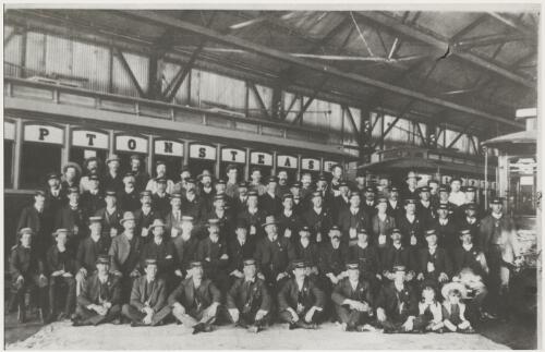 Official portrait of tramways staff in the car barn, probably Kalgoorlie, Western Australia, ca. 1910 [picture]