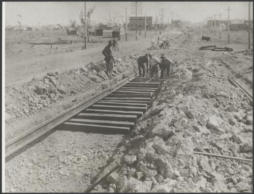 We're getting way out into the suburbs now; putting ballast in the tram tracks, Kalgoorlie, Western Australia, 1902 [picture]