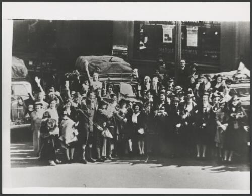 People lining the street for a parade, Sydney, ca. 1930, 2 [picture]