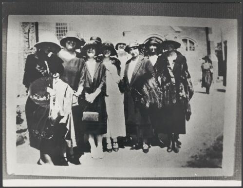 Group of female guests at a wedding standing outside a church, 1925 [picture]