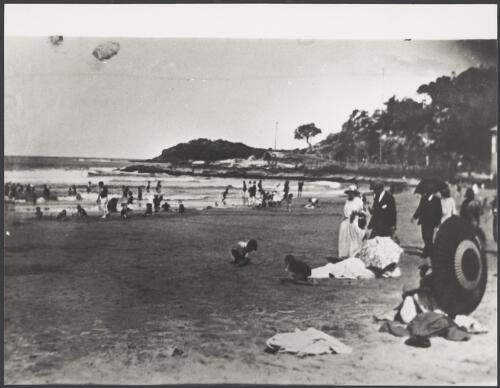 People at a beach, ca. 1910 [picture]