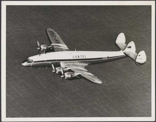 Aerial view of Qantas Constellation L749A flying over the ocean, operated by Qantas on routes from Australia to England, South Africa and Japan, 1947-1955 [picture]