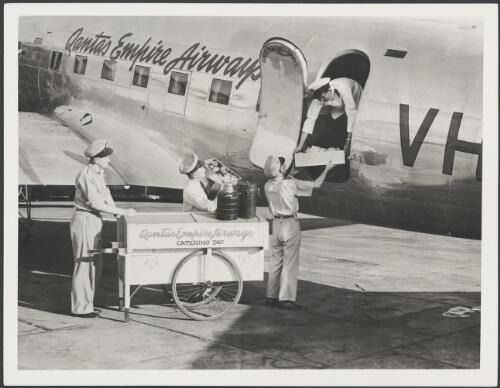 Loading catering supplies on board a Qantas DC3 operating on the Queensland Internal service, Archerfield Aerodrome, Brisbane, ca. 1947 [picture]