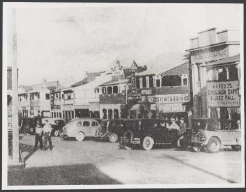 Cars and shopfronts in the main street of Southport, Queensland, ca. 1935 [picture]