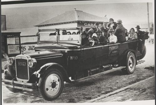 Pioneer tourist coach with passengers, ca. 1925 [picture]