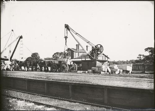 Unloading stone blocks at the railway station, Harcourt, Victoria, ca. 1928 [picture]