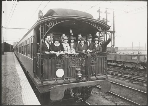 Group gathered in the observation deck of a railway carriage, Melbourne, ca. 1925 [picture]