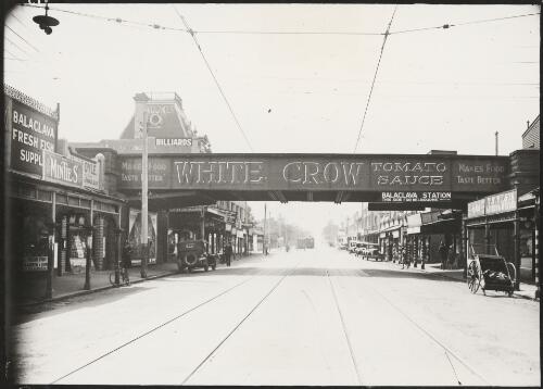 Advertising for White Crow tomato sauce on railway bridge over a street, Balaclava, Victoria, ca. 1928 [picture]