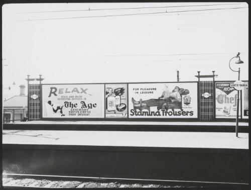 Advertising billboard for the Age newspaper, Colda De-Luxe refrigerators, Stamina trousers and Chef flour on the railway platform, South Yarra, Victoria, ca. 1930 [picture]