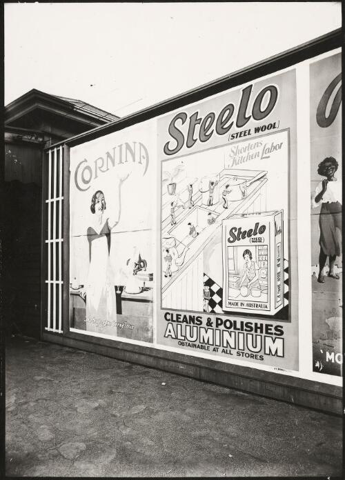Advertising billboard for Cornina cornflour, and Steelo steel wool on a railway platform, Melbourne, ca. 1930 [picture]