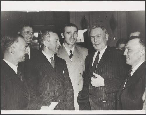 Prime Minister Chifley with newly naturalised citizens, Sydney, 11 February 1949 [picture]
