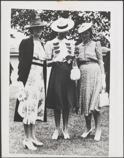 Three women on the lawn at the Caulfield Cup, Melbourne, 1940 [picture]