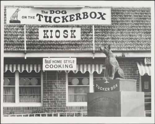 View of the Dog on the tuckerbox kiosk at Snake Gully showing the Dog on the tuckerbox statue in front, Gundagai, New South Wales, ca. 1970 [picture]