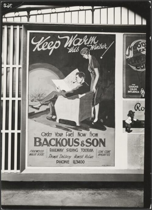 Advertising billboard for Backhous & Son fuel suppliers on a railway platform, Melbourne, ca. 1930 [picture]