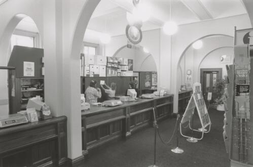 Post Office interior with Postal Manager Darrell Henderson and Postal Services Officers Donna Hunt and Veronica Selemes Goulburn [picture] / Joyce Evans
