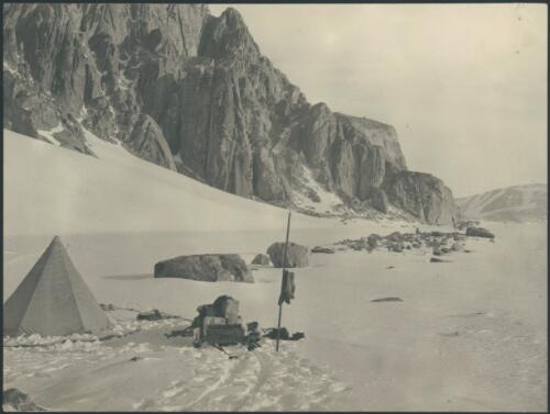 [Campsite with rocky edge in background, Australasian Antarctic Expedition, 1911-1914] [picture]