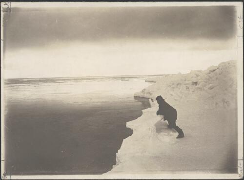 [Unidentified man standing at edge of pack ice, Australasian Antarctic Expedition, 1911-1914] [picture]