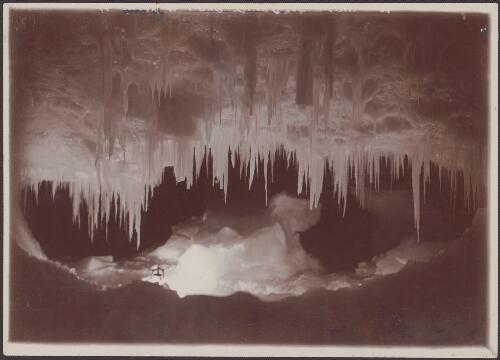 Stalactites draping a cave in a tilted iceberg near Cape Barne, [British  Antarctic Expedition, 1907-1909] [picture]