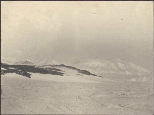 3000 feet up Beardmore Glacier, Cloudmaker in background to the right, the glaciated rock terraces are foothills above the Cloudmaker, [British Antarctic Expedition, 1907-1909] [picture]