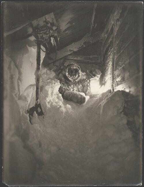 [Mertz at the snow covered entrance of a hut. Australasian Antarctic Expedition, 1911-1914] [picture] / Hurley