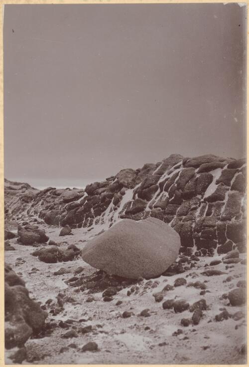Granite erratic, 4ft x 3ft x 2ft lying in glacially eroded wide groove in kenyte lava, High Hill, near Cape Royds, [British Antarctic Expedition, 1907-1909] [picture]