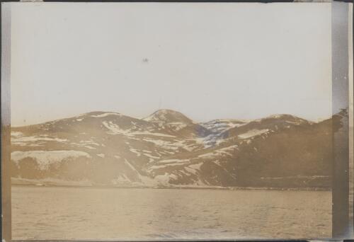 [Snow capped hills with water in foreground, Australasian Antarctic Expedition, 1911-1914] [picture]