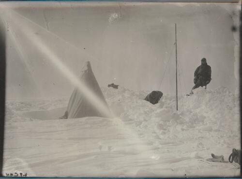 [Two members erecting a camp site, Australasian Antarctic Expedition, 1911-1914] [picture] / [C. Archibald Hoadley]