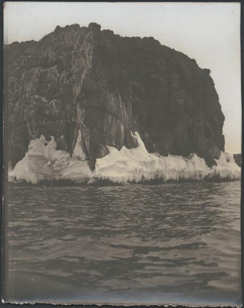 [Snow at the bottom of a cliff near the water's edge, Australasian Antarctic Expedition, 1911-1914] [picture]