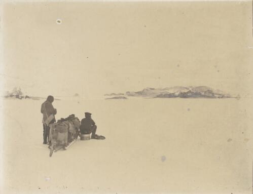 Looking towards the Reeves Glacier with the Hansen Nunatak showing just over the sledges, [British Antarctic Expedition, 1907-1909] [picture]