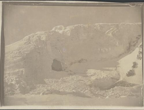 Cave in Turks Head Glacier (Armytage in cave), [British Antarctic Expedition, 1907-1909] [picture]