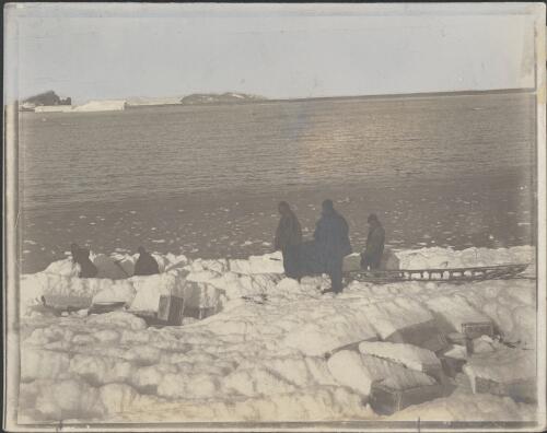 [Crates which are partly covered by ice near the sea edge, British Antarctic Expedition, 1907-1909] [picture]