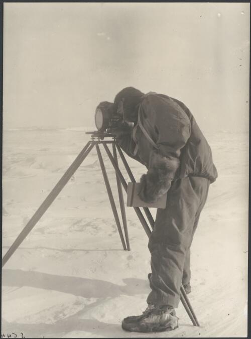 [A member of the party looking through a theodolite, Australasian Antarctic Expedition, 1911-1914] [picture]/ Hoadley