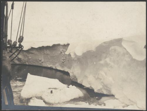 North side of glacier tongue showing snow cornice formed by the southerly blizzards, [Australasian Antarctic Expedition, 1911-1914] [picture]