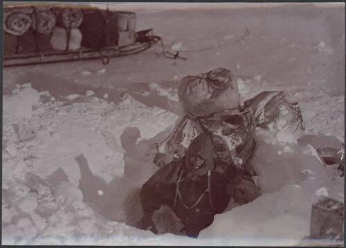 Mertz emerging from Aladdin's Cave, [Australasian Antarctic Expedition, 1911-1914] [picture] / Hurley