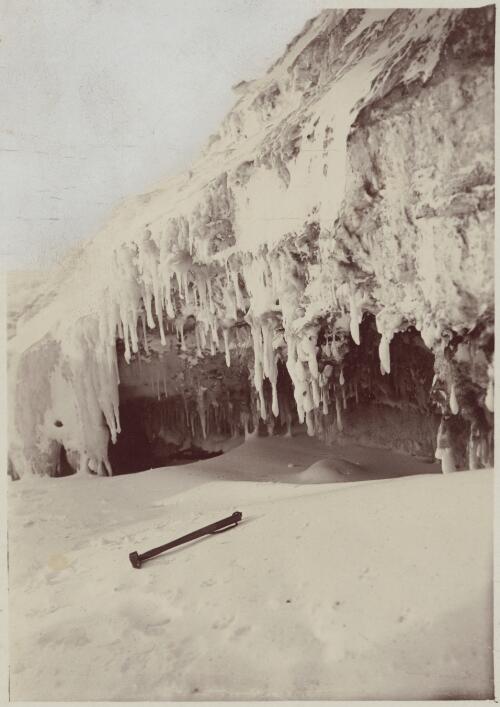 [Icicles hanging over a steep cliff ledge, Australasian Antarctic Expedition, 1911-1914] [picture]