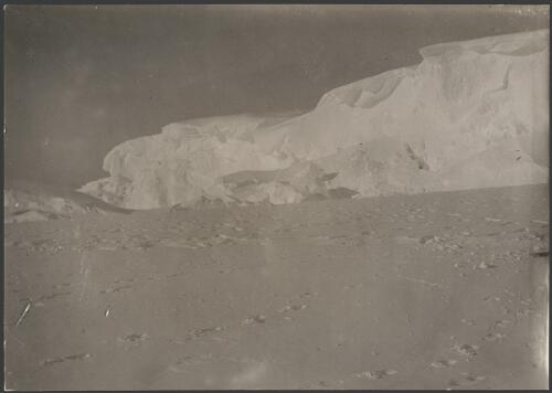 [Footsteps in the snow, with ice capped cliffs in the background] [picture] / [C. Archibald Hoadley]