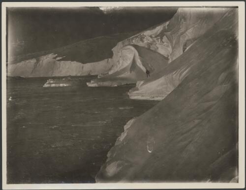 [The coast line east of John O'Graots showing winter snow depositions below cliff, Australasian Antarctic Expedition, 1911-1914] [picture]
