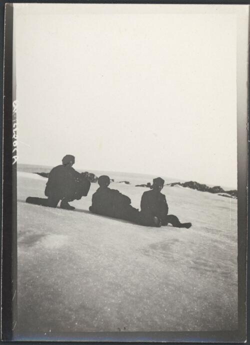 [Three members of the expedition sitting in the snow, Australasian Antarctic Expedition 1911-1914 ] [picture] / Coombe