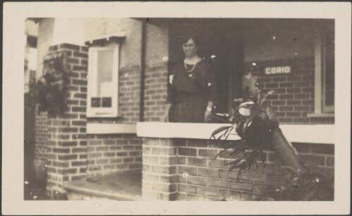 Elizabeth Haynes' sister standing on porch, Sydney, approximately 1930 / Albert Dryer