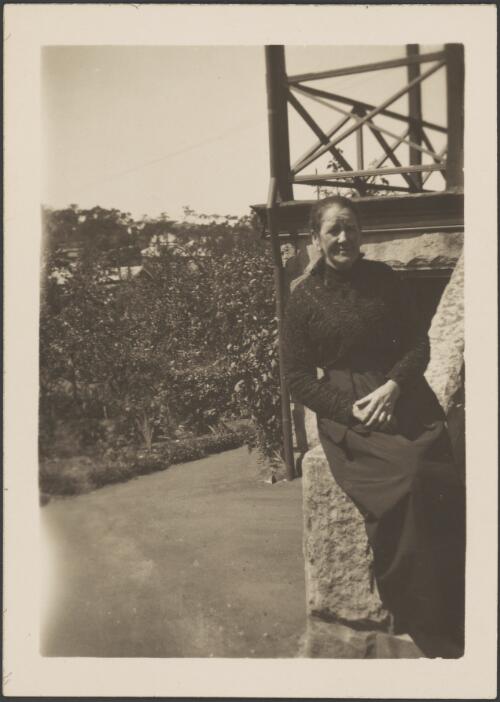 Woman sitting on a sandstone balustrade, Sydney, approximately 1930 / Albert Dryer